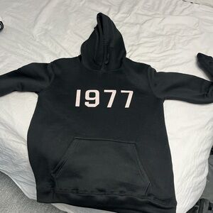 Black Hoodie with 1977 Print Essentials fear of god